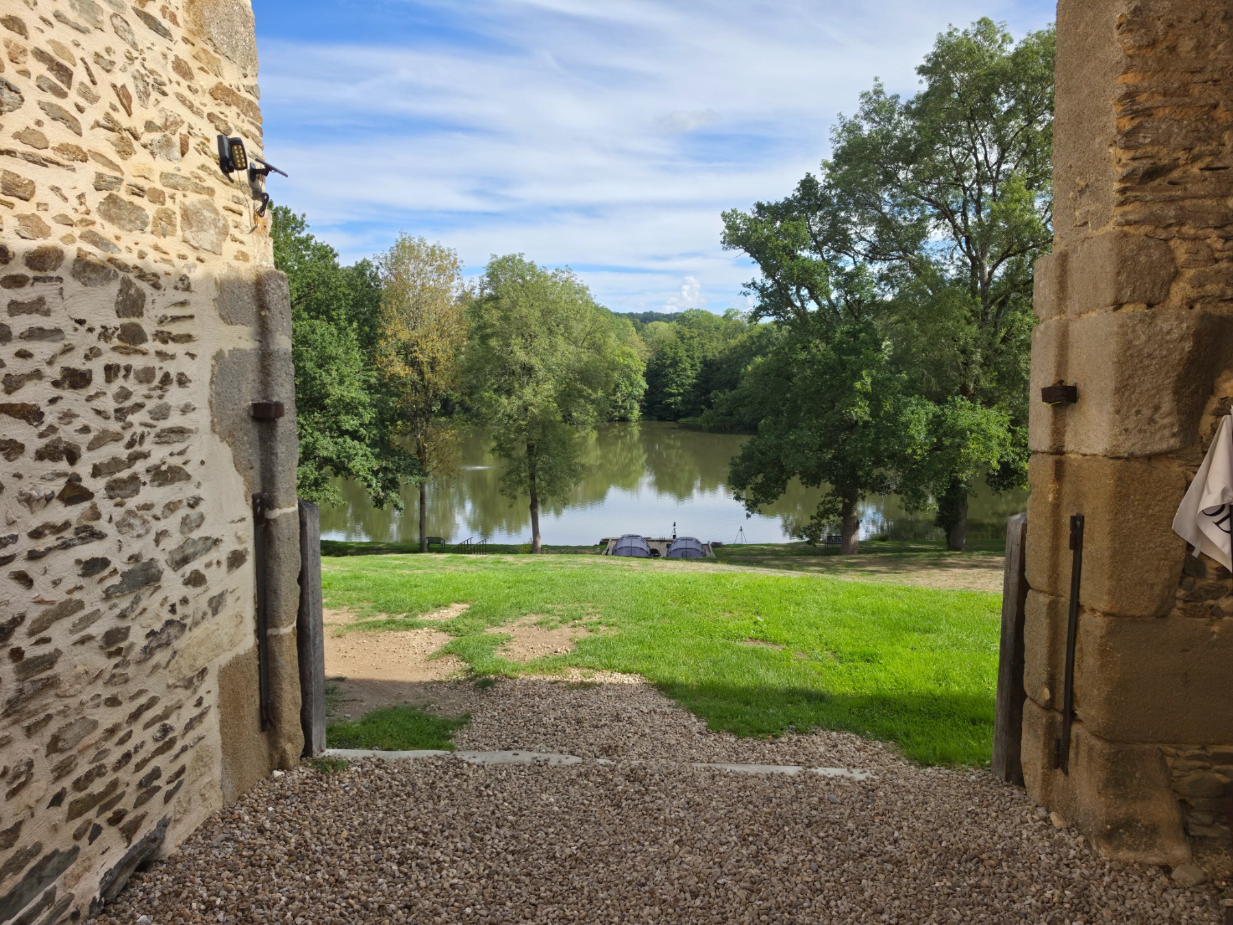 Looking out of the barn doorway towards the lake