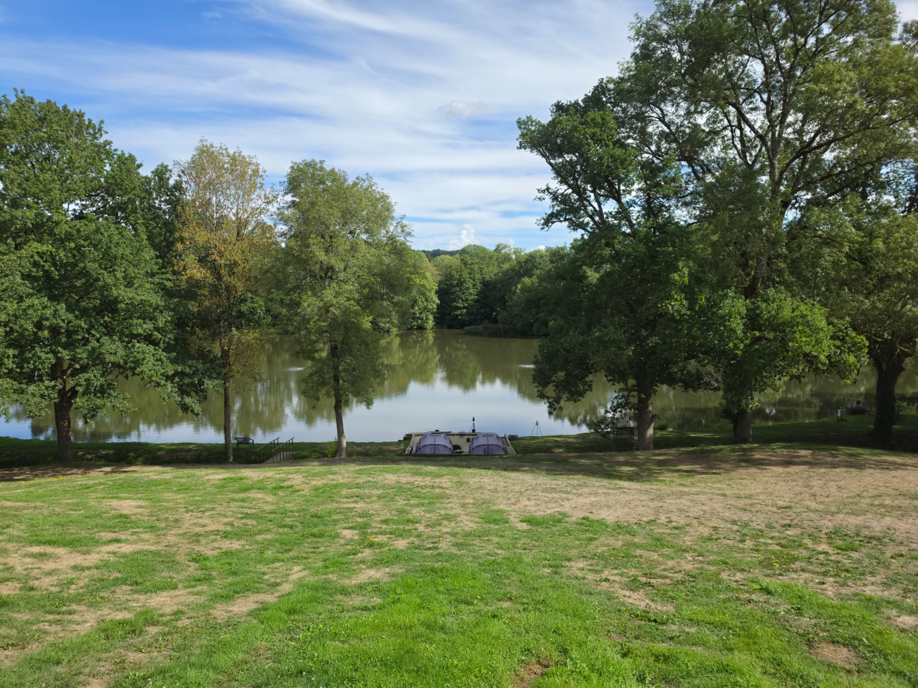 The lawn running down to Heron Lake